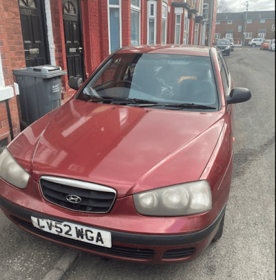 Red Hyundai Elantra with cracked front windscreen before FixGlass windscreen replacement