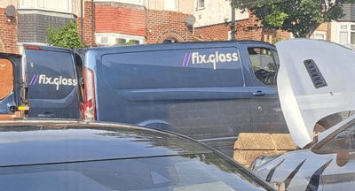 FixGlass technician performing professional car windscreen rock chip repair on site