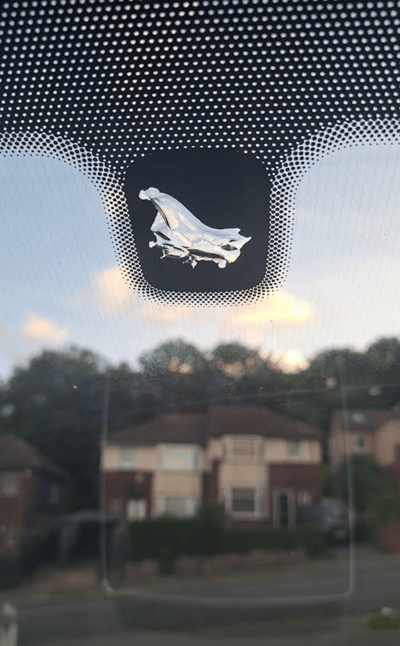 Close-up of car windscreen after FixGlass repair showing pristine glass
