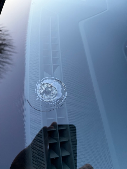 Close-up of a windscreen chip that is too large to repair